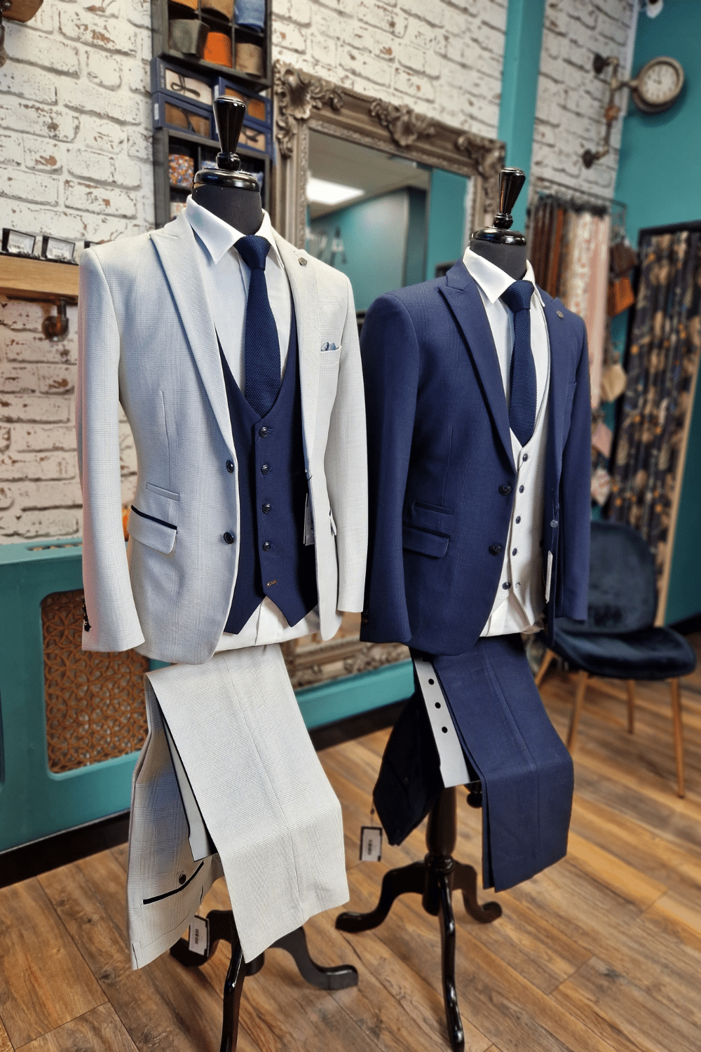 Two wedding suits dressed on mannequin's