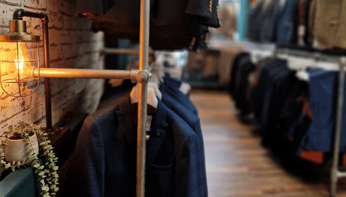 Wedding suits hanging in a suit shop