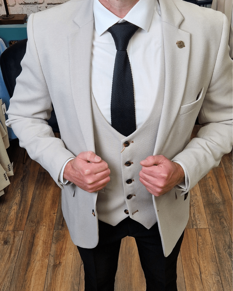 Stone blazer and waistcoat with black trousers